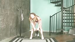 Gorgeous long haired teen strips and spreads pussy
